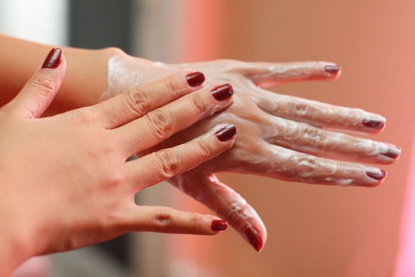 applying cream on hands for skin rejuvenation